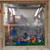 "UNTITLED"  Ready Made Wood Box, little easel, seven plastic dwarfs, acrylic grass, mirror, size 50 x 50 x 25 cm. 2009